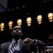 Michigan junior Tim Hardaway Jr. watches a highlight real during the basketball banquet on Tuesday, April 16. AnnArbor.com I Daniel Brenner